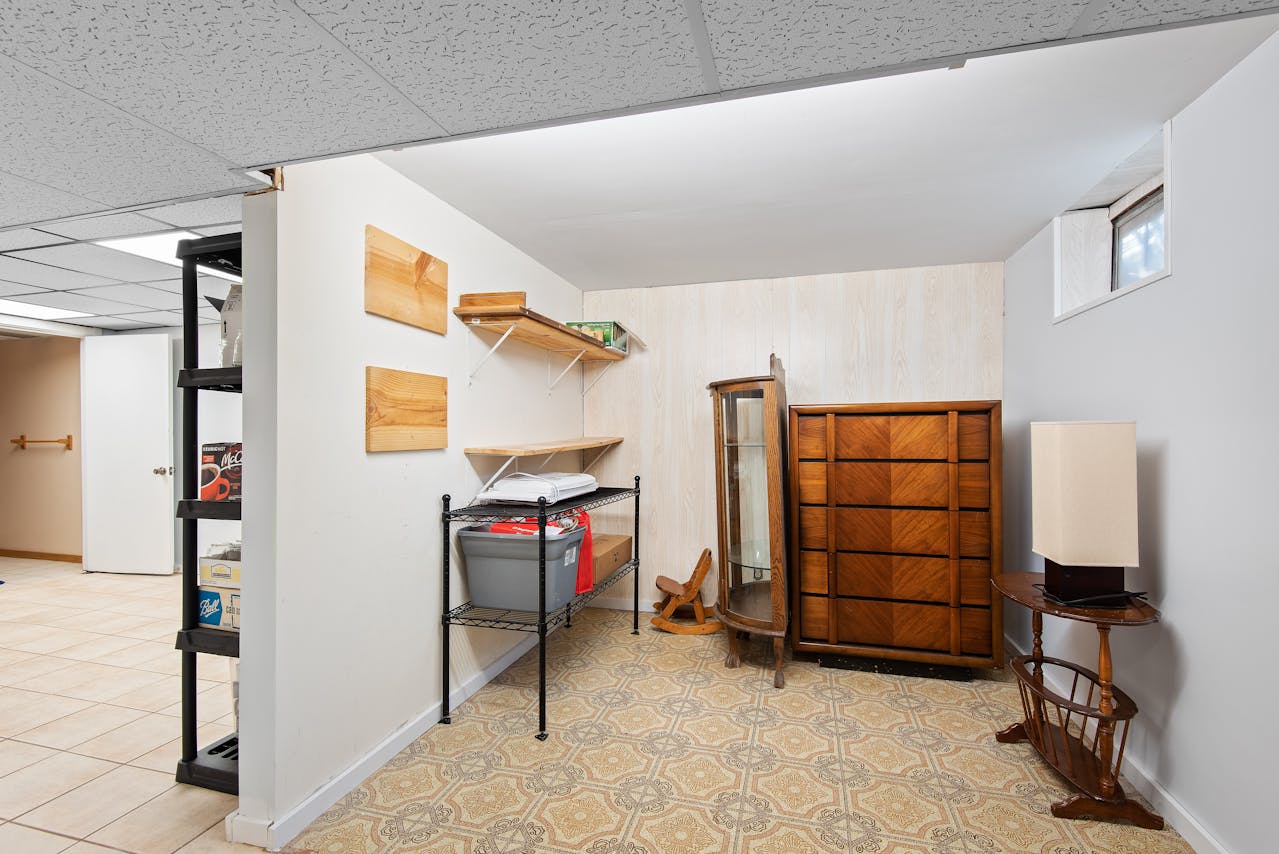Organized home pantry with shelves of stored items demonstrating well-planned home storage. Image by Pexels