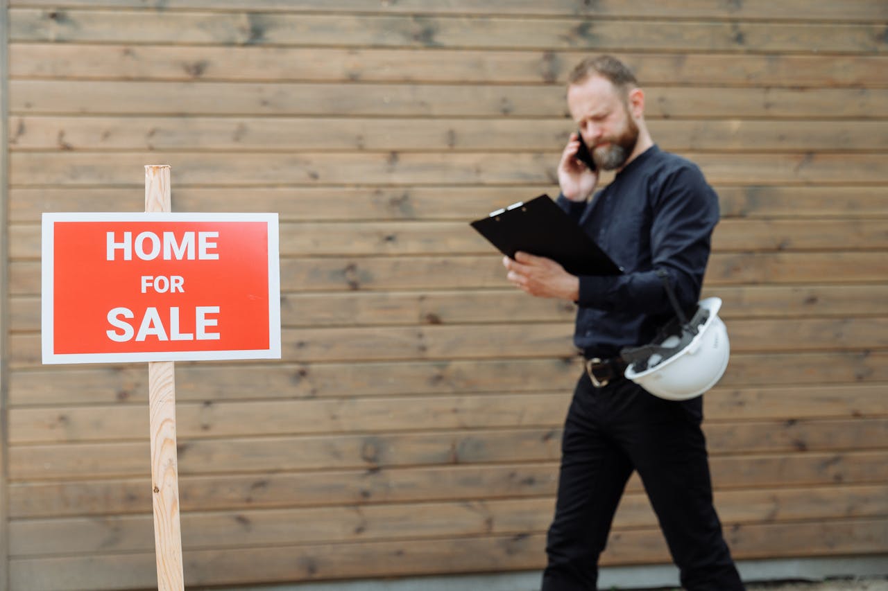 Red home for sale sign. Iamge by Pexels