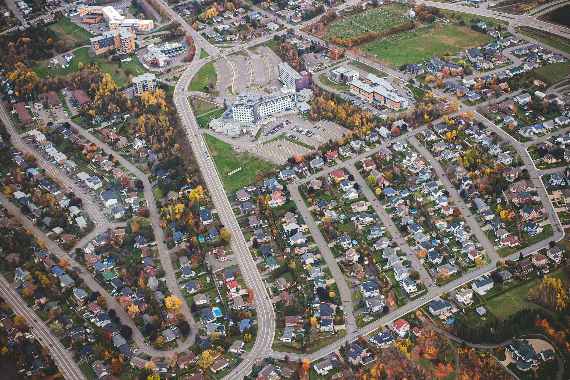 Arial view of houses and roads. Image by Unsplash